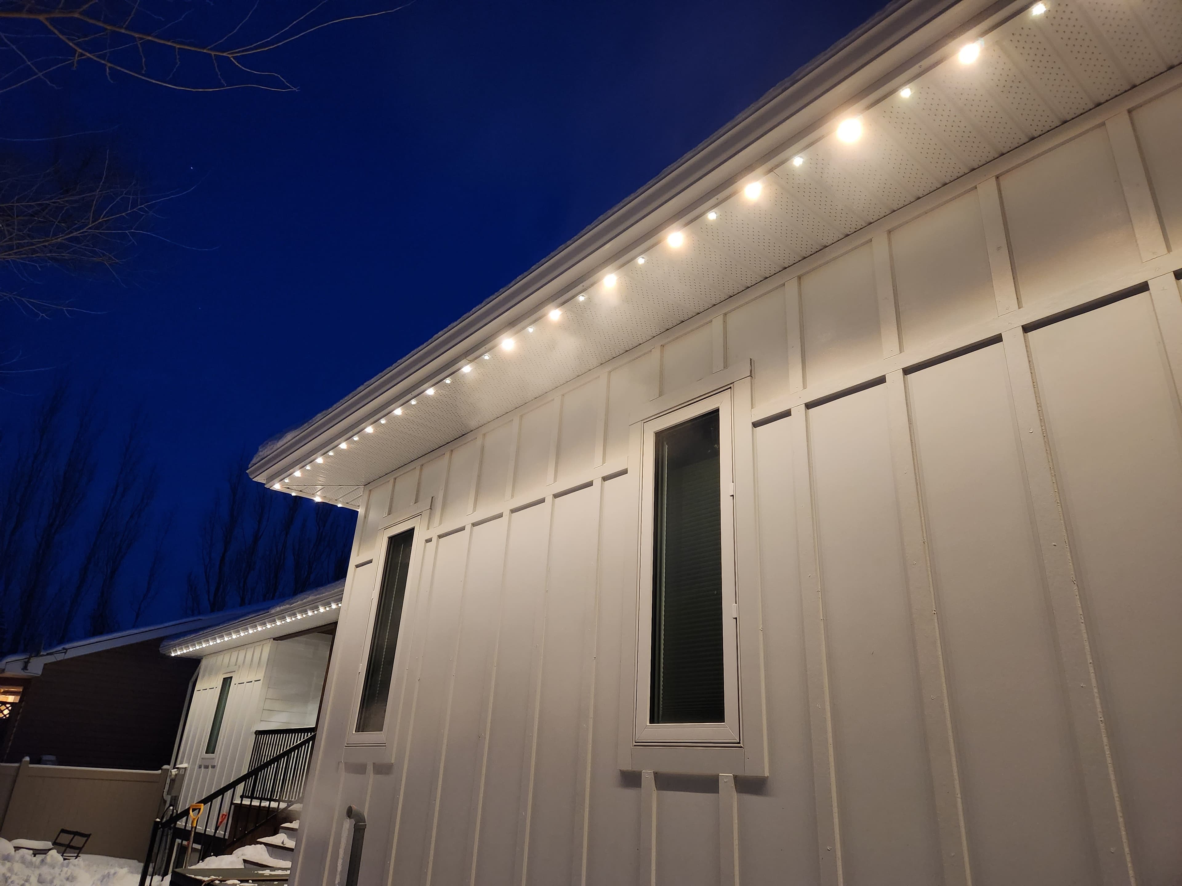 Close-up of the commercial-grade RGB LED light pucks Halton Glow uses for permanent outdoor lighting installations, showing pink, magenta, gold, green and teal nodes
